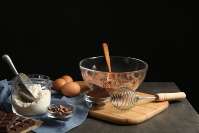 Photo of Ingredients for chocolate dough on grey table