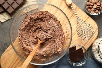 Photo of Ingredients for chocolate dough on grey table, flat lay