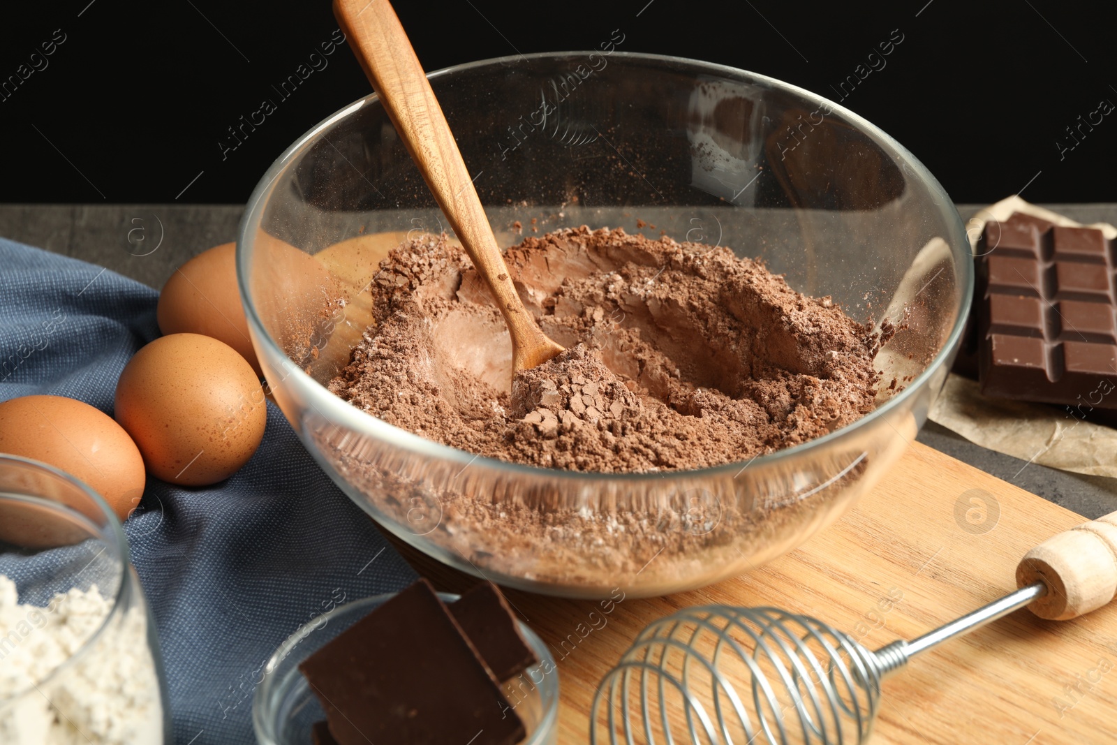 Photo of Ingredients for chocolate dough on grey table