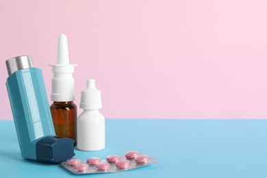 Photo of Different asthma medications on color background, closeup. Space for text