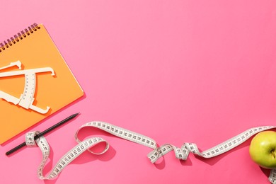 Photo of Body fat caliper, measuring tape, notebook and apple on pink background, flat lay. Space for text