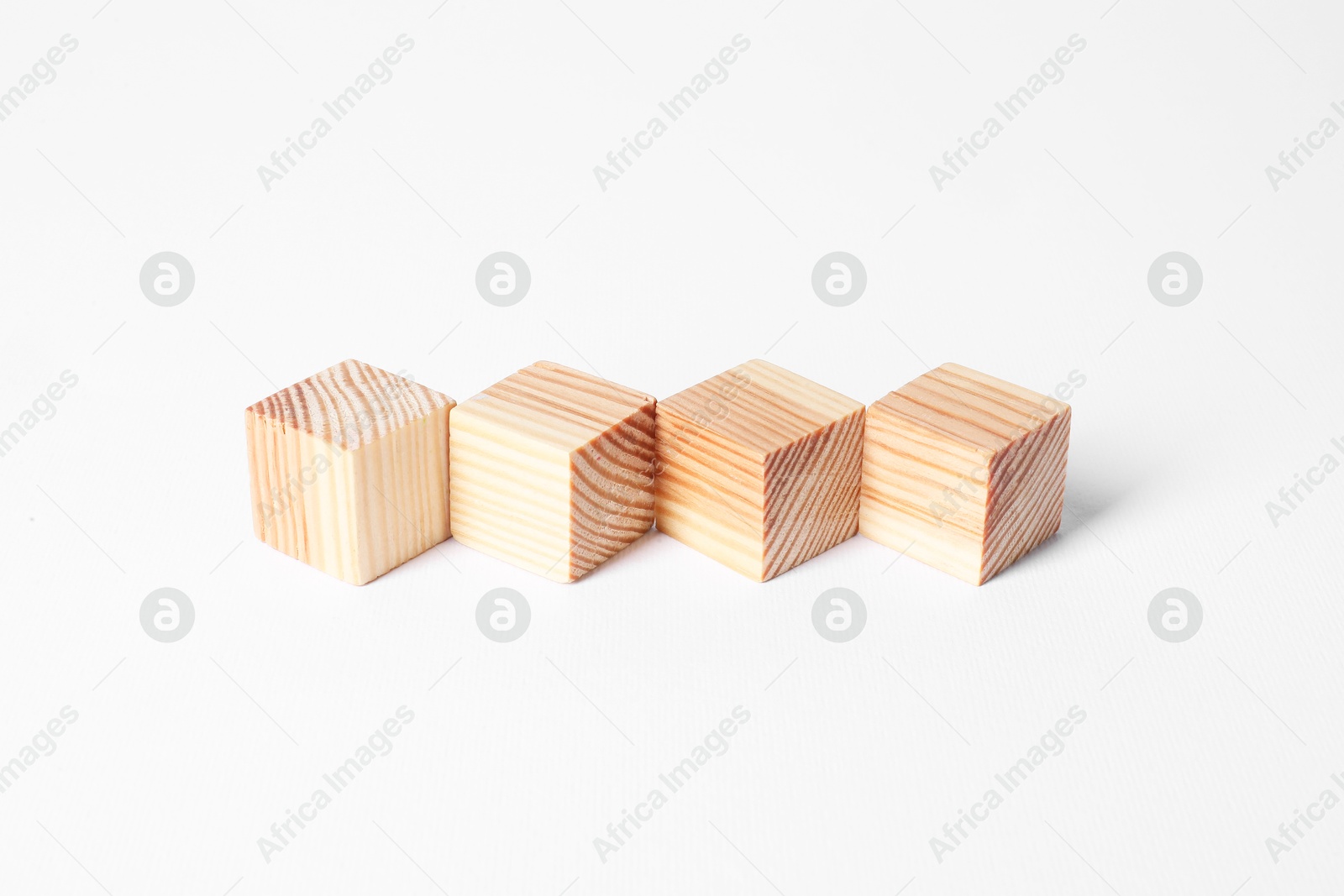 Photo of Many blank wooden cubes on white background