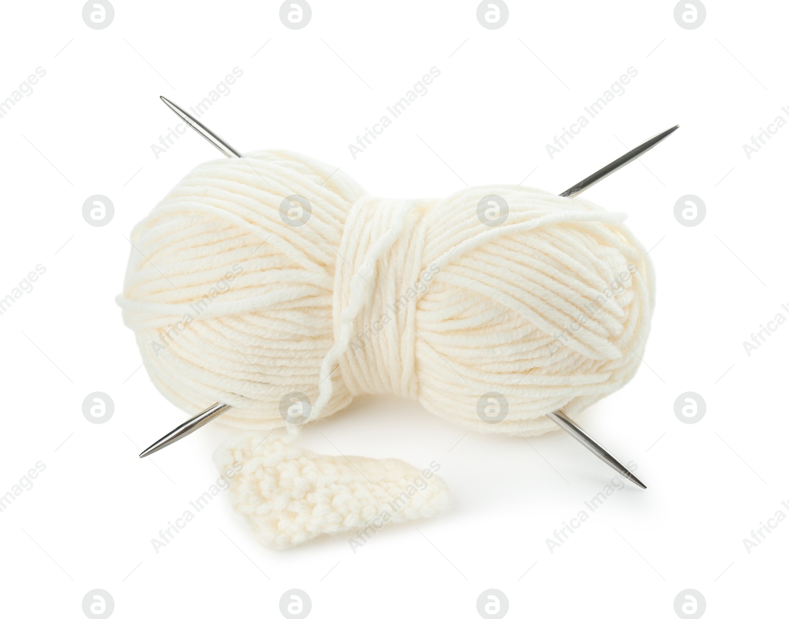 Photo of Skein of soft yarn with knitting needles and pattern sample isolated on white