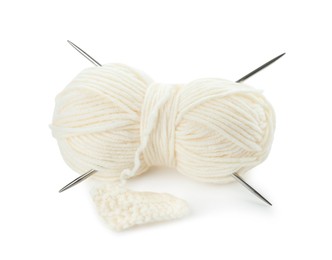 Photo of Skein of soft yarn with knitting needles and pattern sample isolated on white