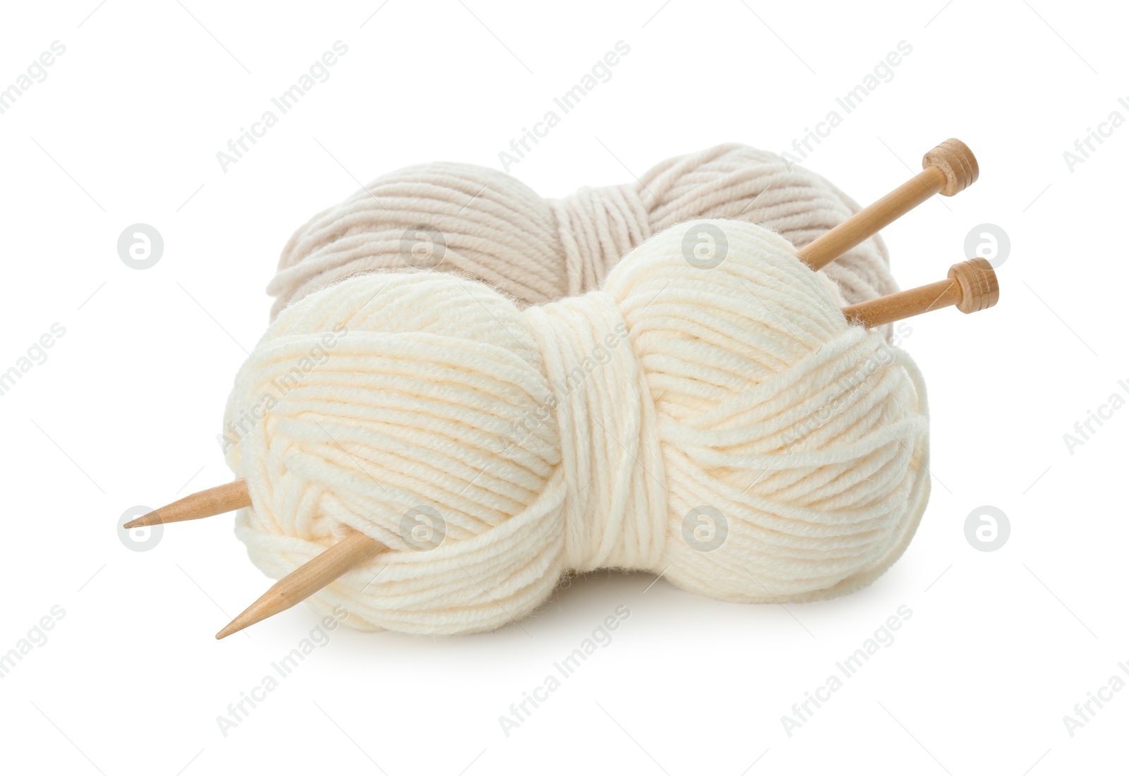 Photo of Skeins of soft yarn and knitting needles isolated on white