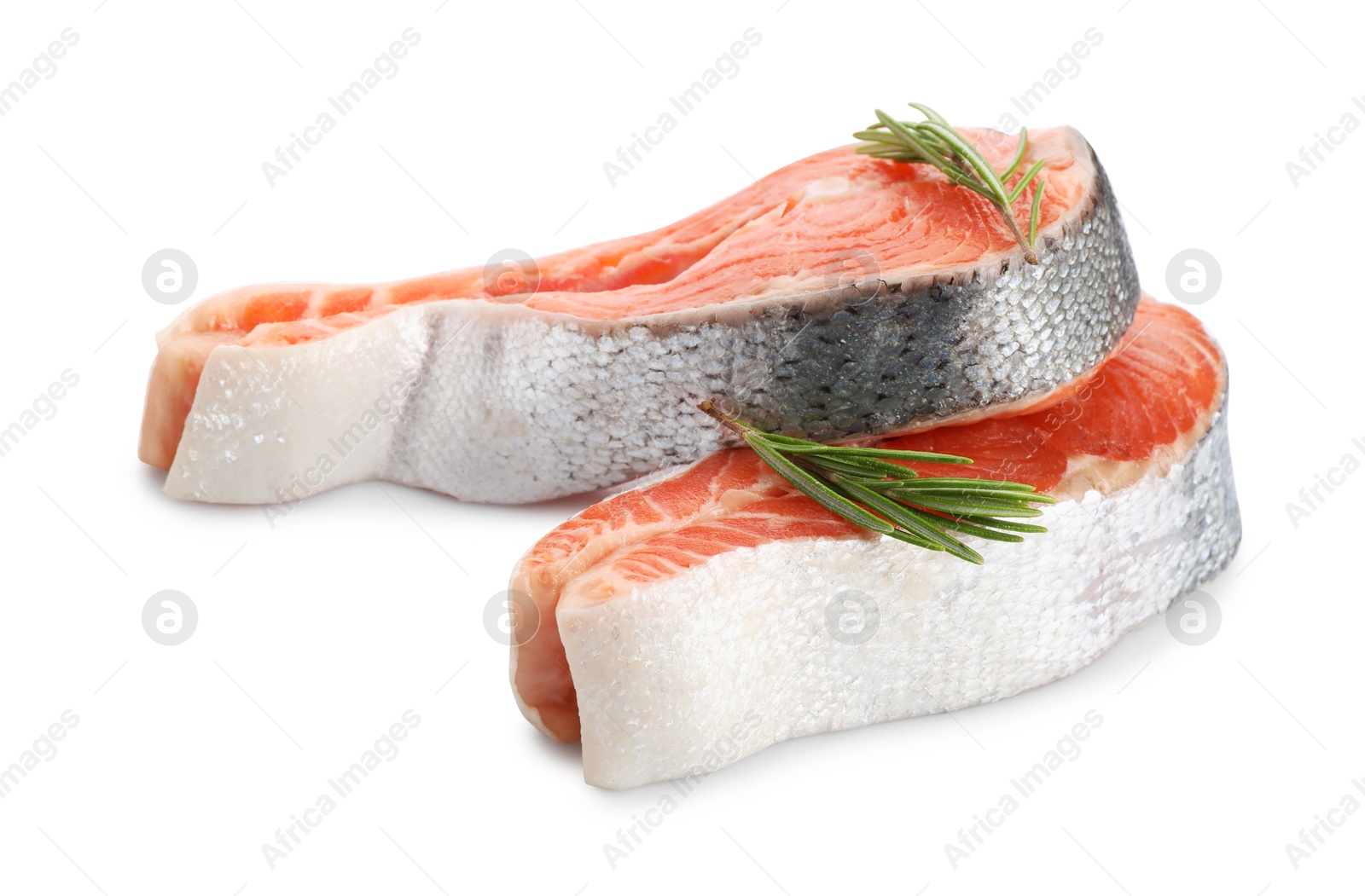 Photo of Two fresh salmon steaks and rosemary isolated on white