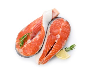 Two fresh salmon steaks, lemon and rosemary isolated on white, top view