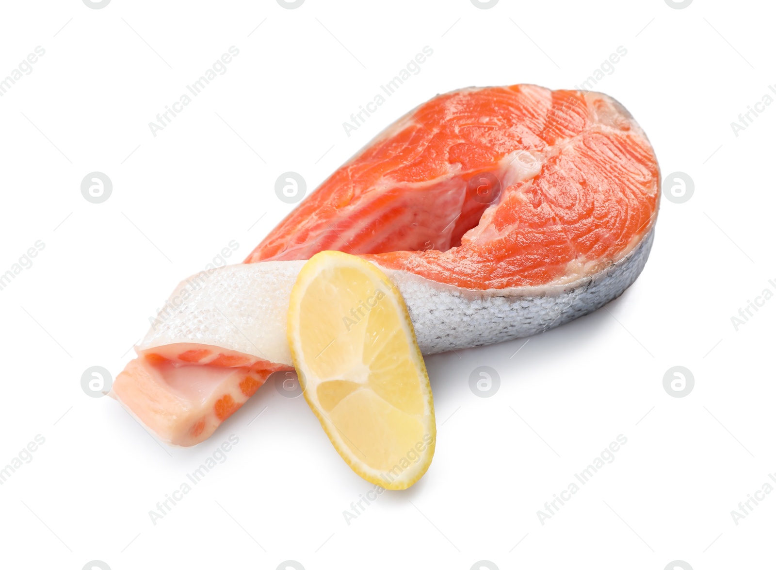 Photo of Fresh salmon steak and piece of lemon isolated on white