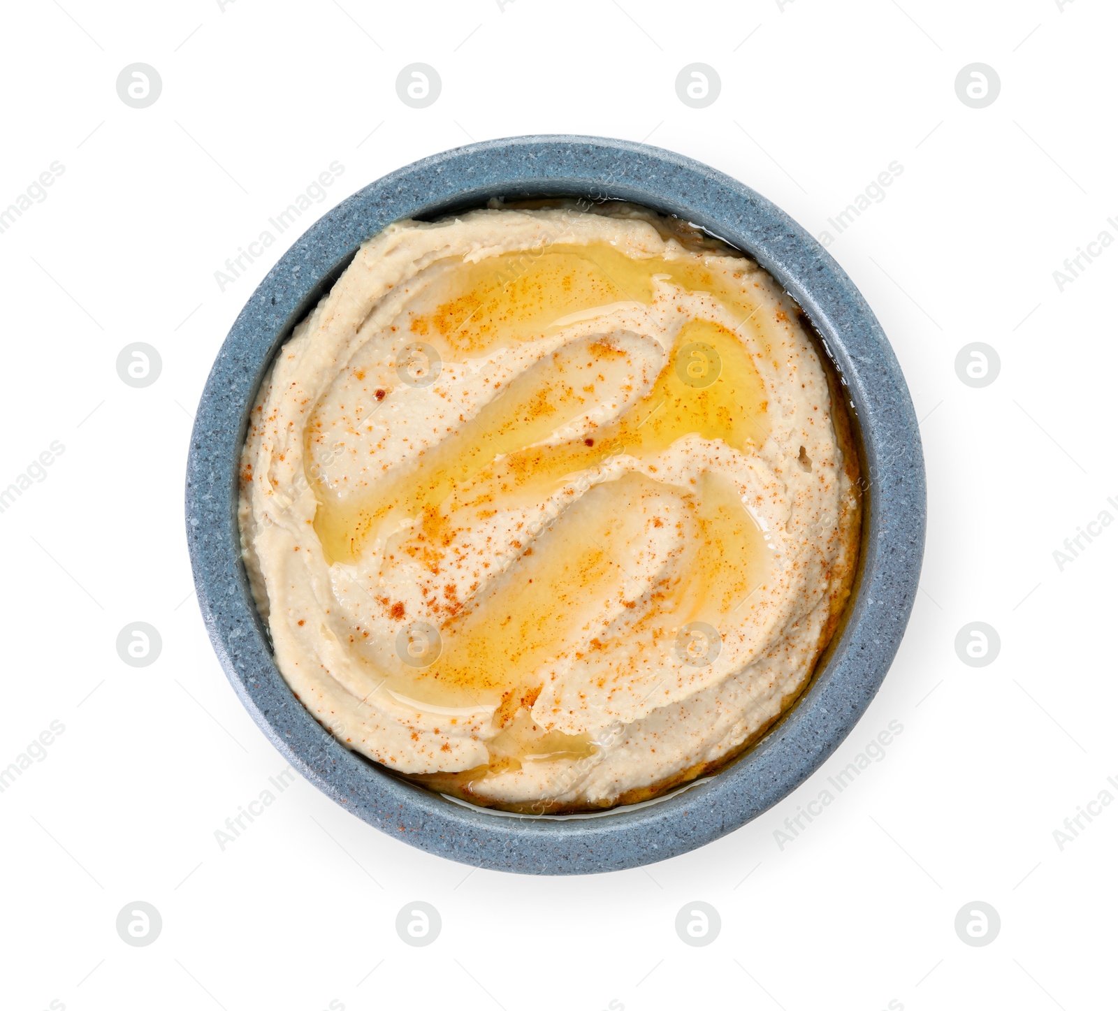 Photo of Delicious hummus with olive oil and paprika isolated on white, top view