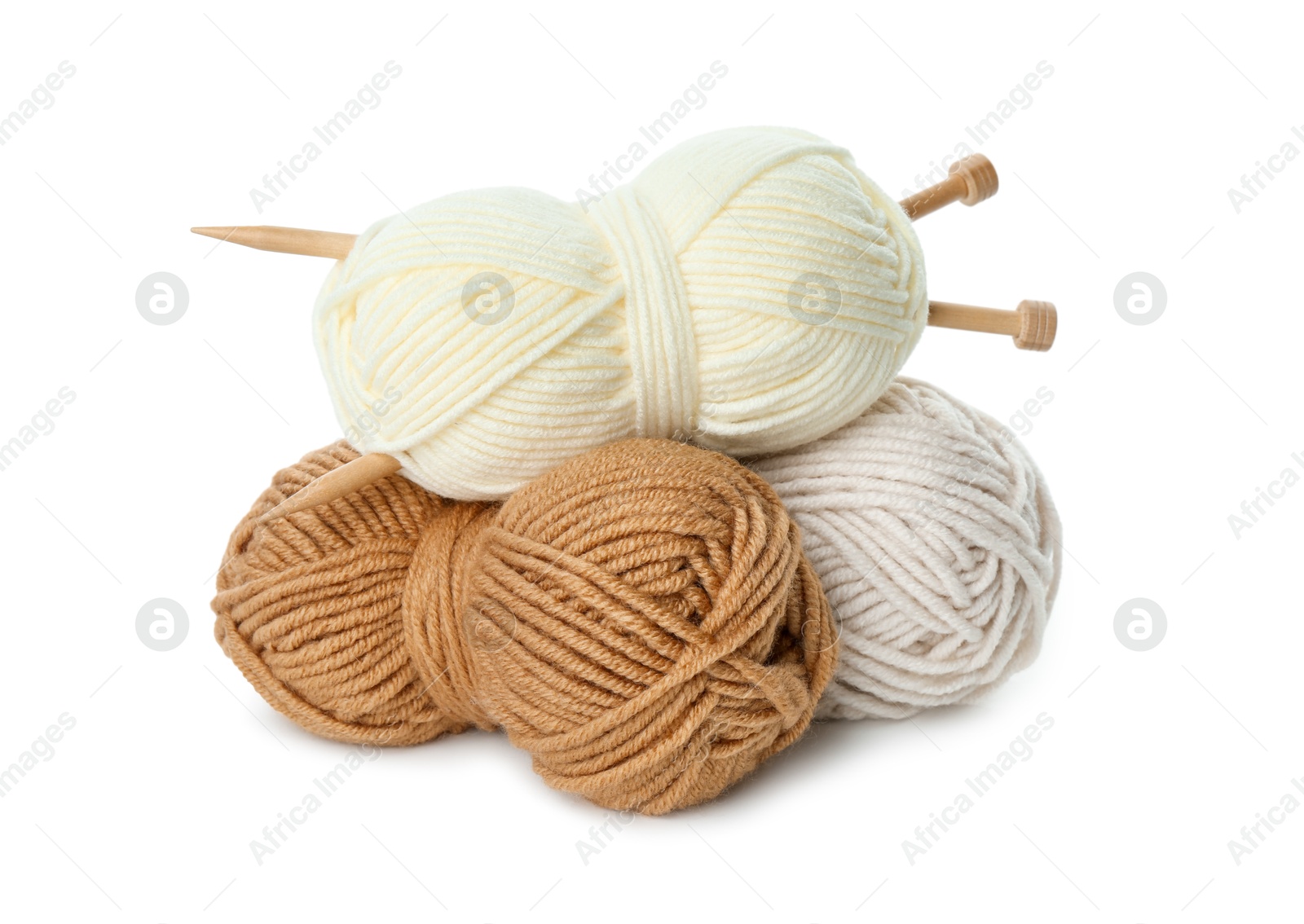 Photo of Skeins of soft yarn and knitting needles isolated on white