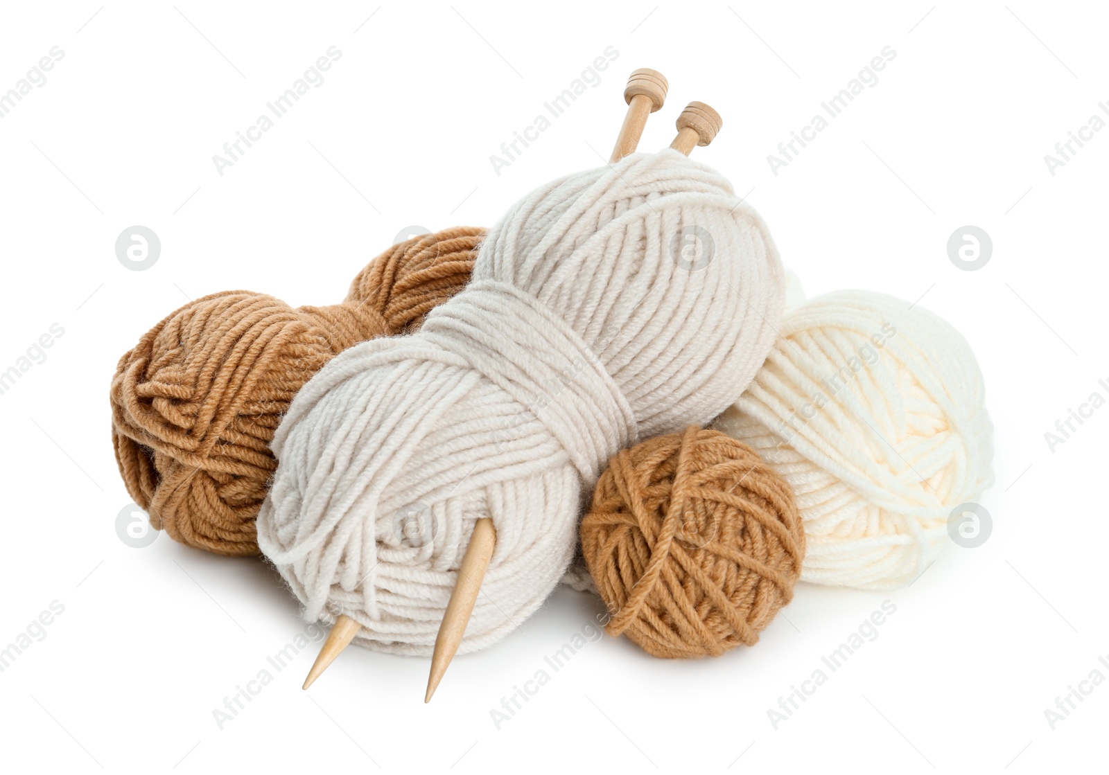 Photo of Skeins of soft yarn and knitting needles isolated on white