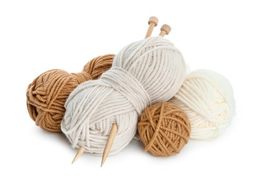 Skeins of soft yarn and knitting needles isolated on white