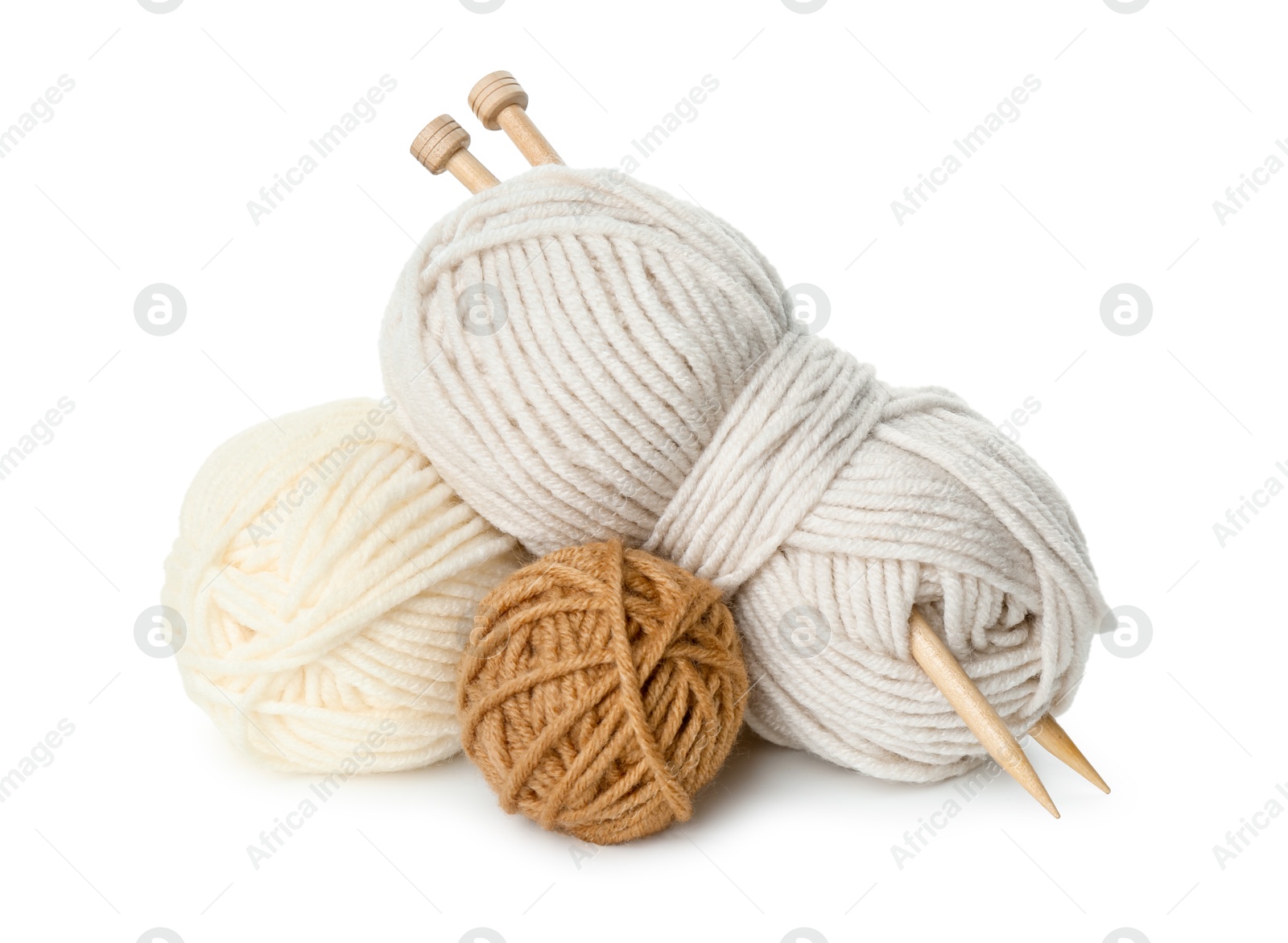 Photo of Skeins of soft yarn and knitting needles isolated on white