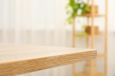 Empty wooden table in living room, closeup