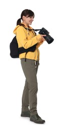 Photographer with backpack and camera on white background