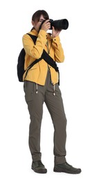 Photo of Photographer with backpack and camera taking picture on white background