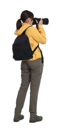 Photo of Photographer with backpack and camera taking picture on white background