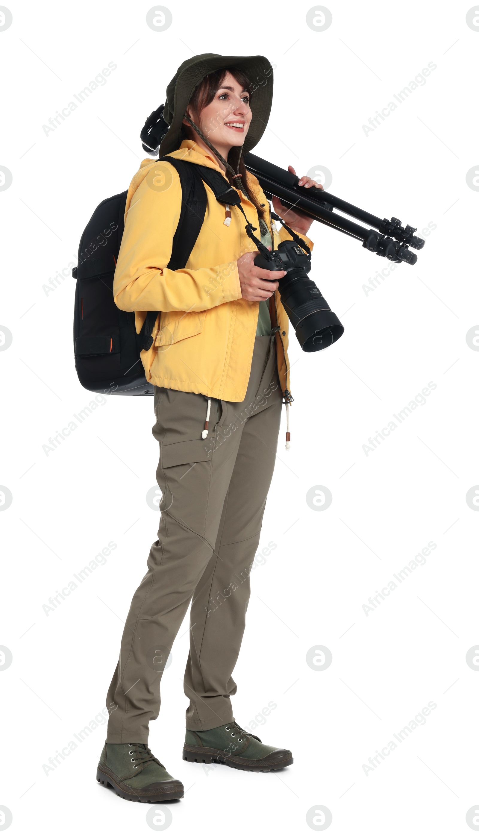 Photo of Photographer with backpack, camera and other professional equipment on white background