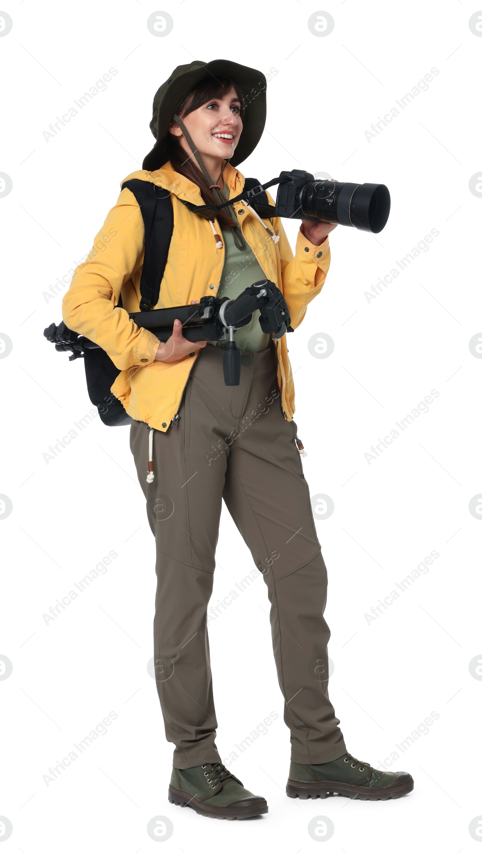 Photo of Photographer with backpack, camera and other professional equipment on white background