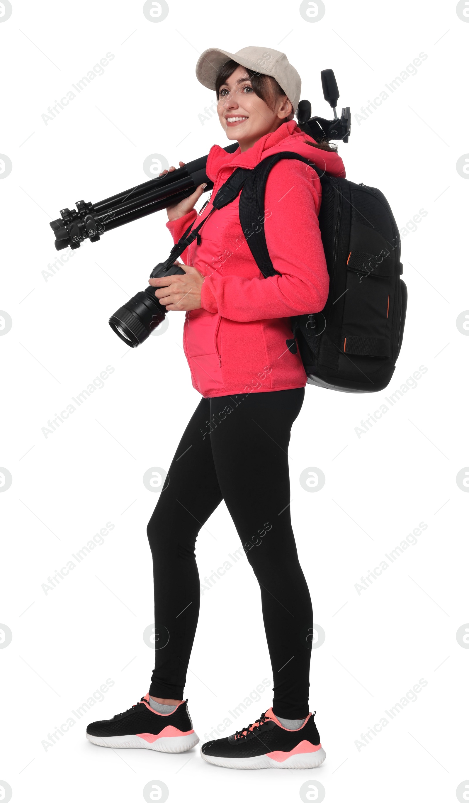 Photo of Photographer with backpack, camera and other professional equipment on white background