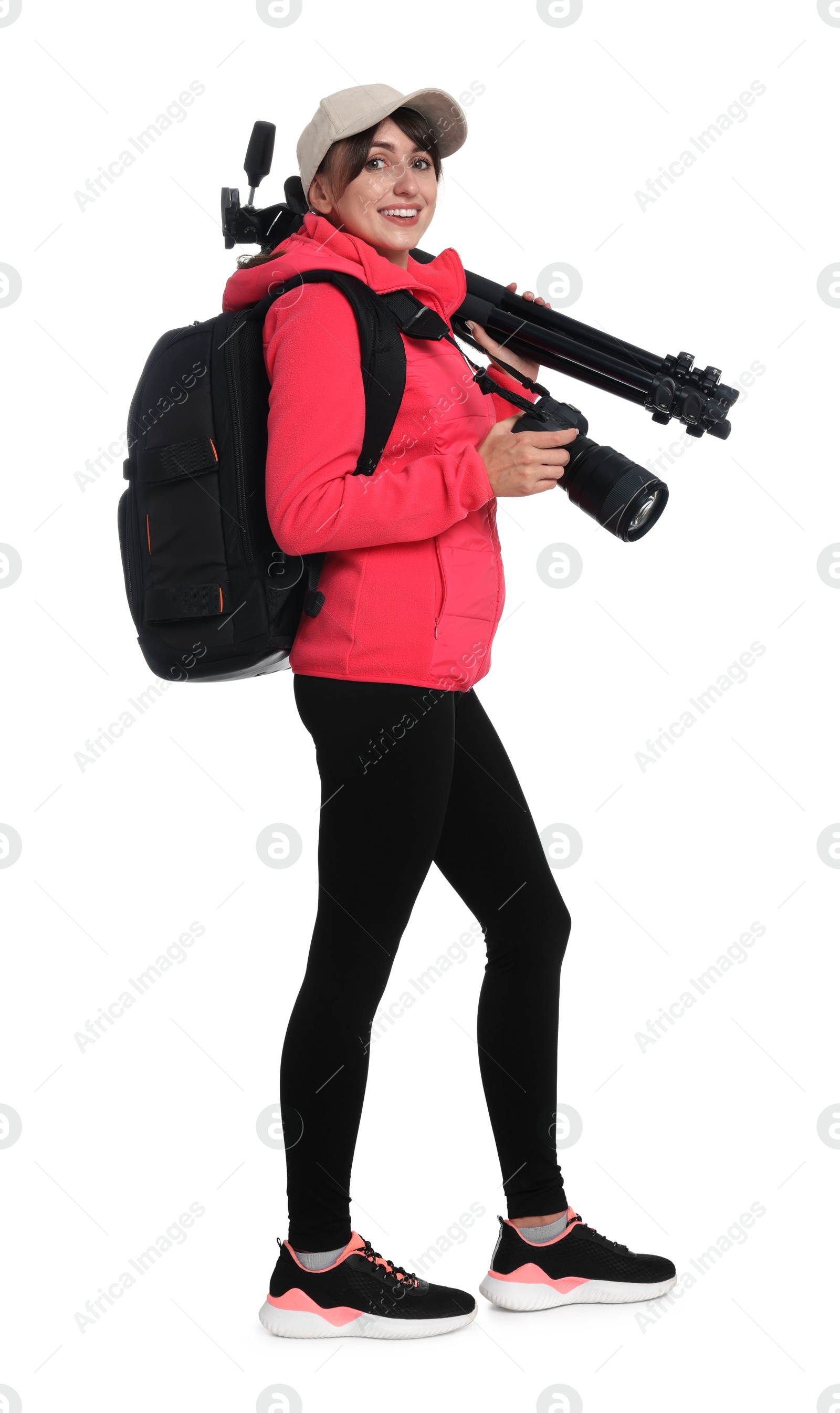 Photo of Photographer with backpack, camera and other professional equipment on white background