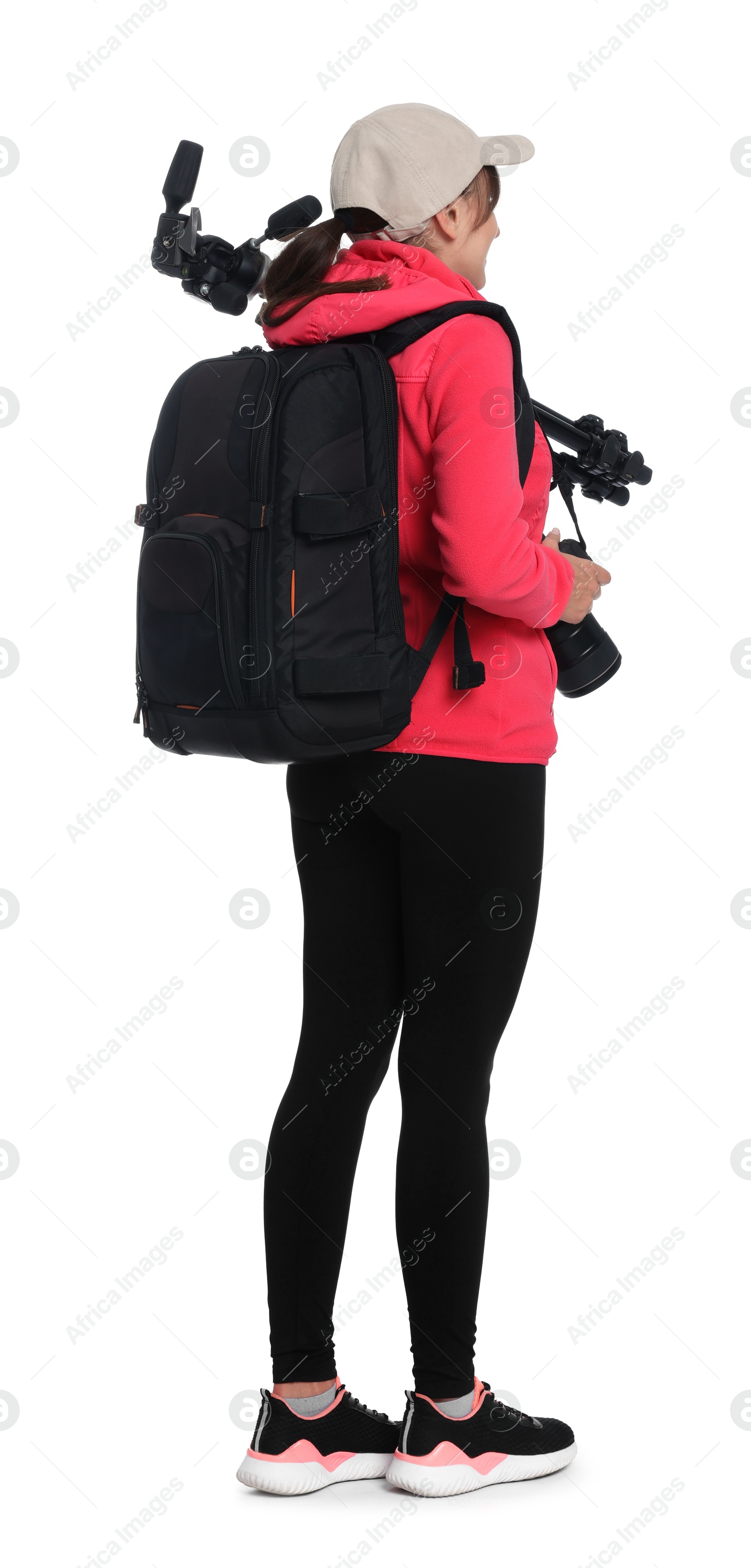 Photo of Photographer with backpack, camera and other professional equipment on white background