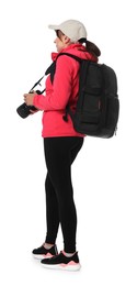 Photographer with backpack and camera on white background