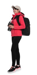 Photographer with backpack and camera on white background