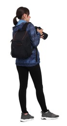 Photographer with backpack and camera on white background