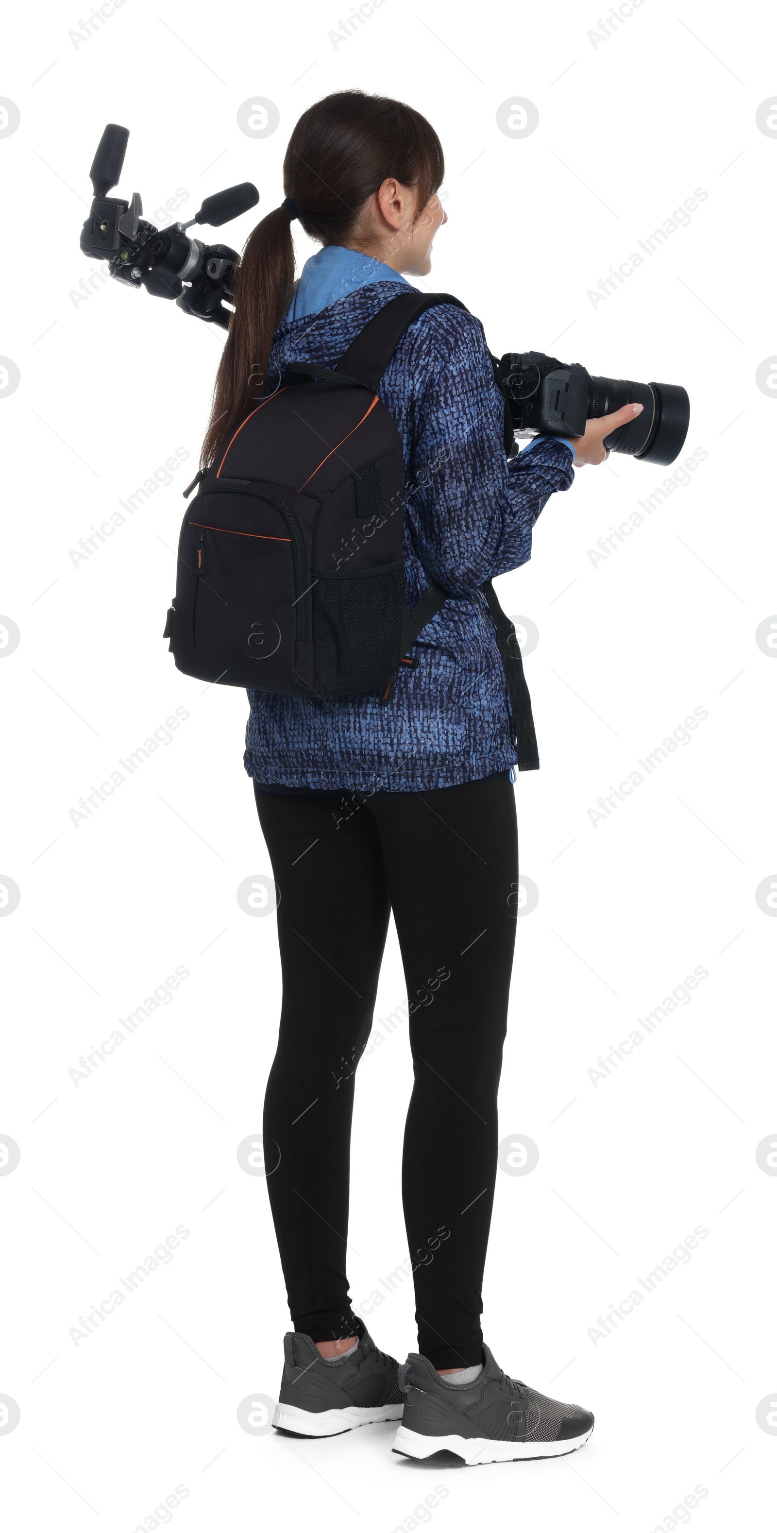 Photo of Photographer with backpack, camera and other professional equipment on white background