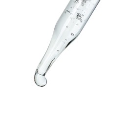 Photo of Dripping cosmetic serum from pipette on white background