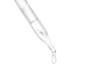 Photo of Dripping cosmetic serum from pipette on white background