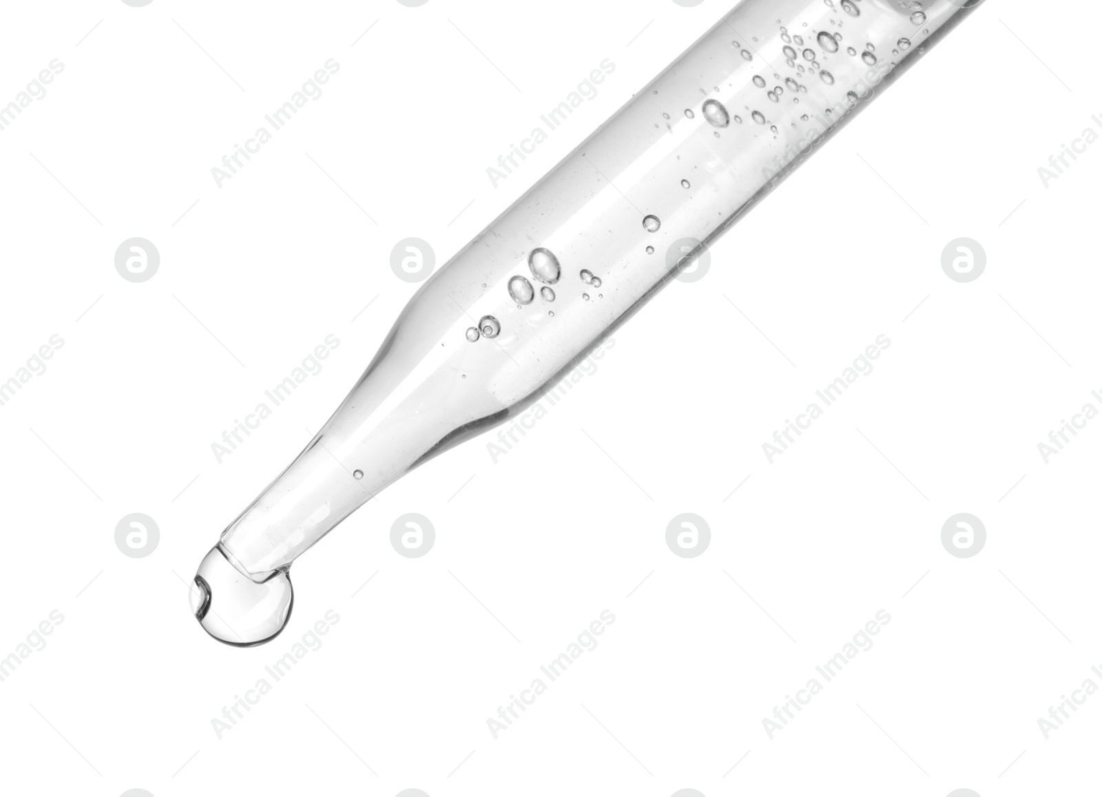 Photo of Dripping cosmetic serum from pipette on white background