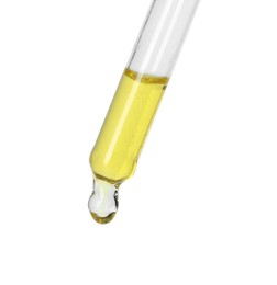 Photo of Dripping essential oil from pipette on white background