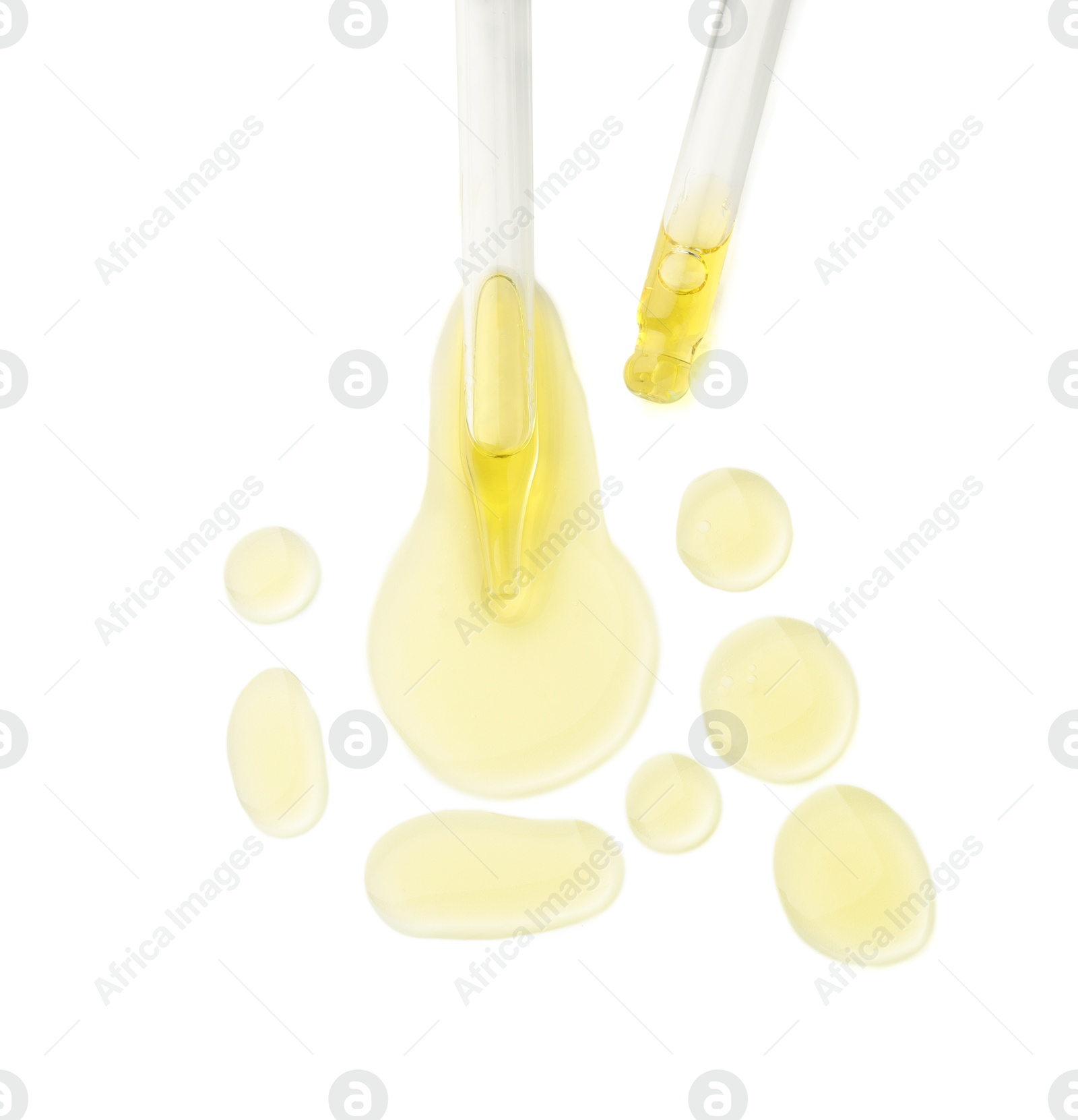 Photo of Cosmetic oil and pipettes isolated on white, top view