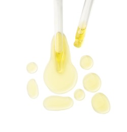 Cosmetic oil and pipettes isolated on white, top view