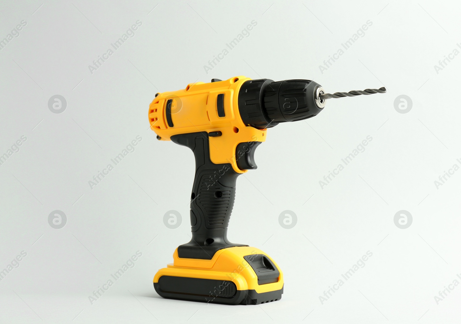 Photo of Modern cordless electric drill on white background