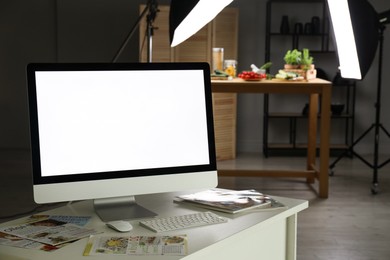 Photo of Shooting food in photo studio with professional lighting equipment, focus on computer