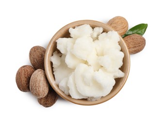 Photo of Shea butter in bowl and nuts isolated on white, top view