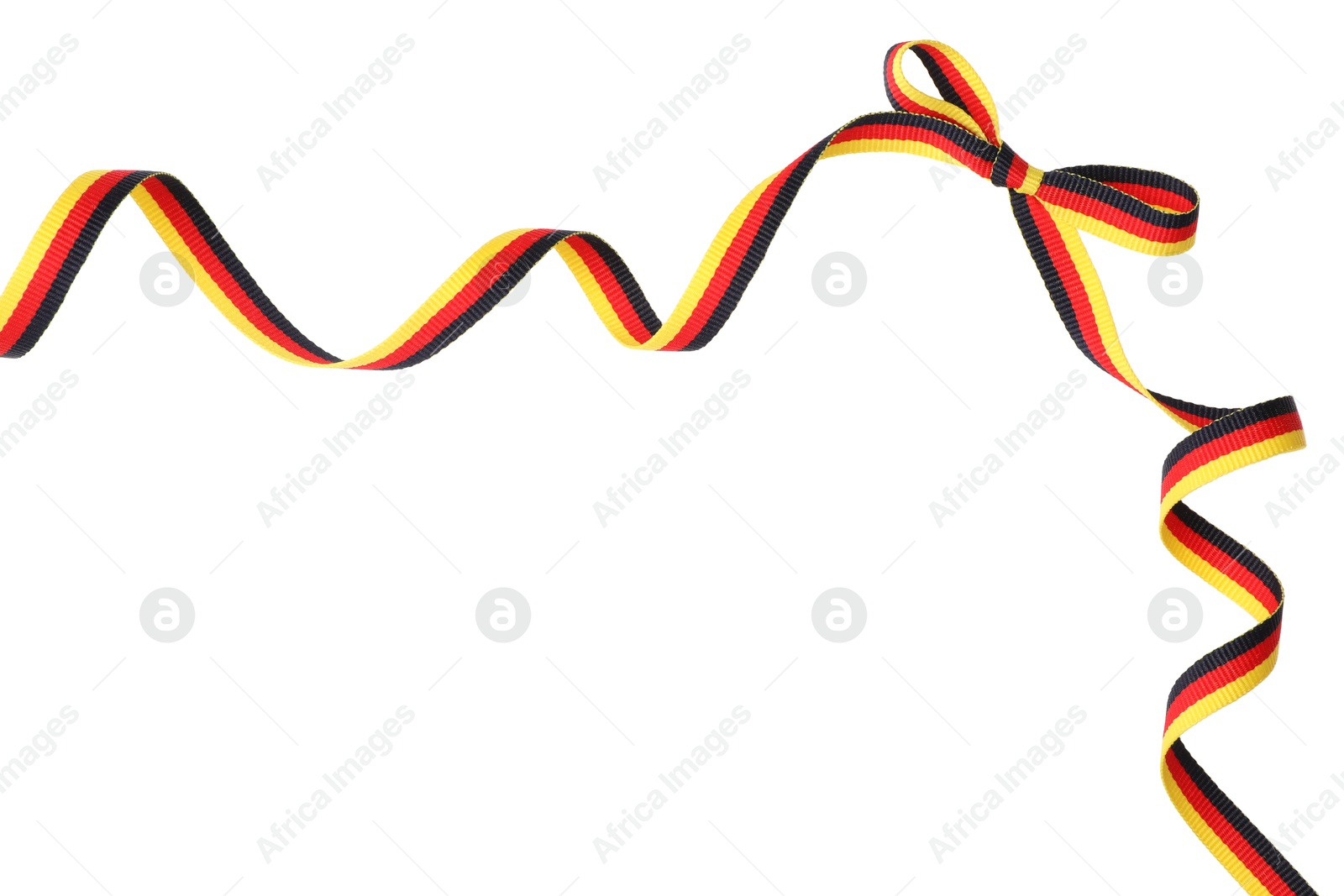 Photo of Ribbon with bow in colors of German flag isolated on white, top view