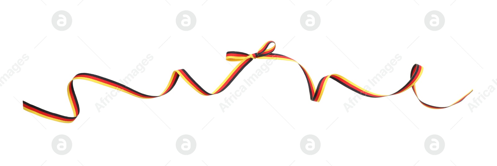 Photo of Ribbon with bow in colors of German flag isolated on white, top view