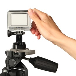 Woman with modern action camera on white background