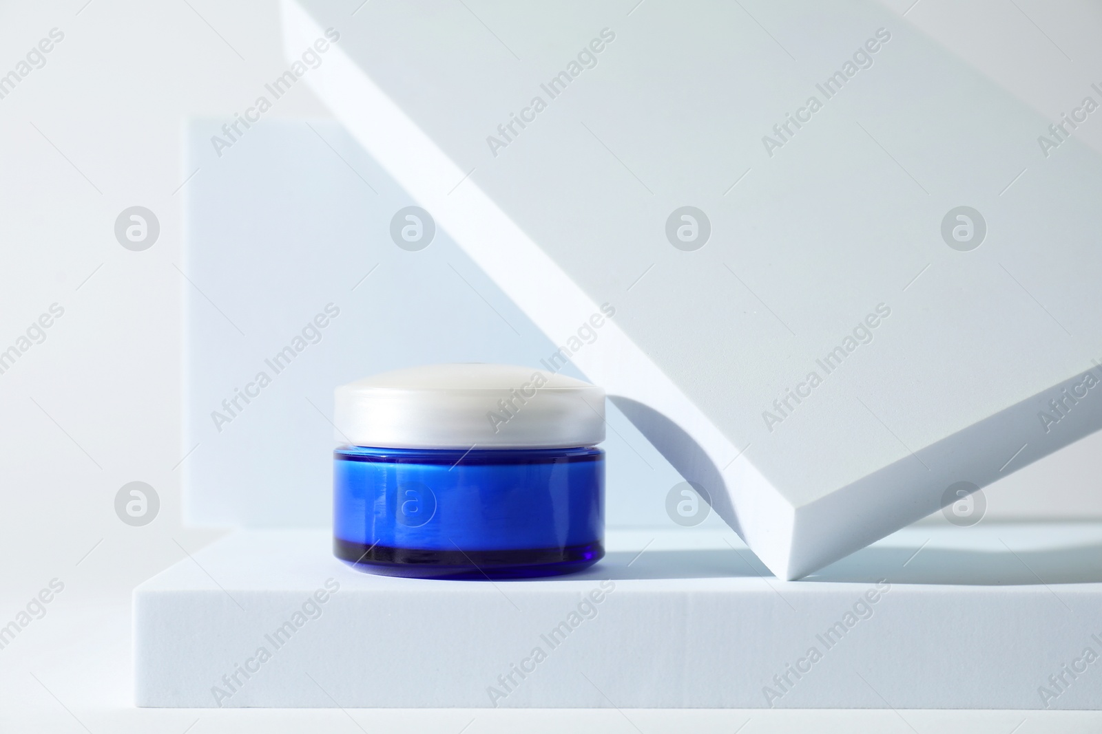 Photo of Stylish presentation of facial cream on white background