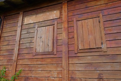 Beautiful wooden building with closed windows outdoors