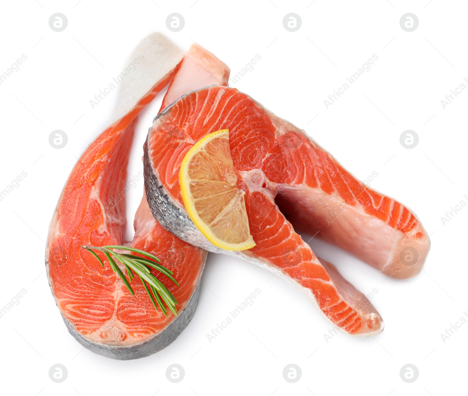 Photo of Two fresh salmon steaks, lemon and rosemary isolated on white, above view