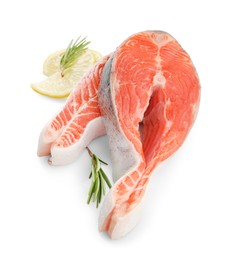 Two fresh salmon steaks, lemon and rosemary isolated on white