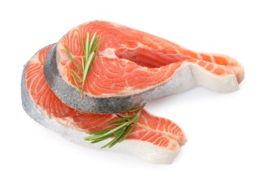 Photo of Two fresh salmon steaks and rosemary isolated on white, above view