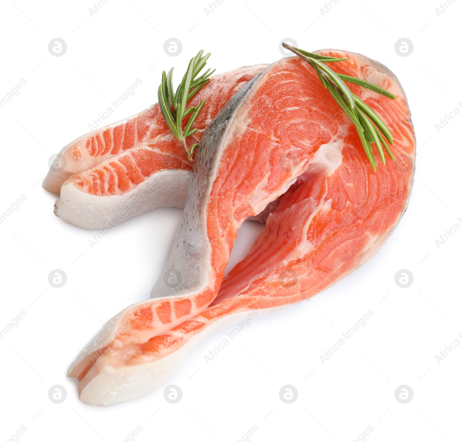 Photo of Two fresh salmon steaks and rosemary isolated on white