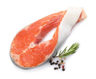 Photo of Fresh salmon steak, peppercorns and rosemary isolated on white, top view