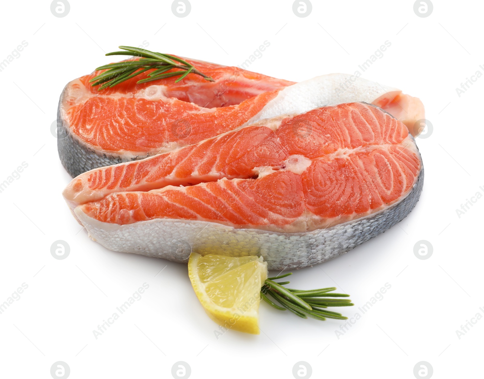 Photo of Two fresh salmon steaks, lemon and rosemary isolated on white